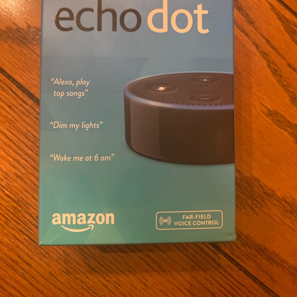 Brand new Echo Dot still in taped box.